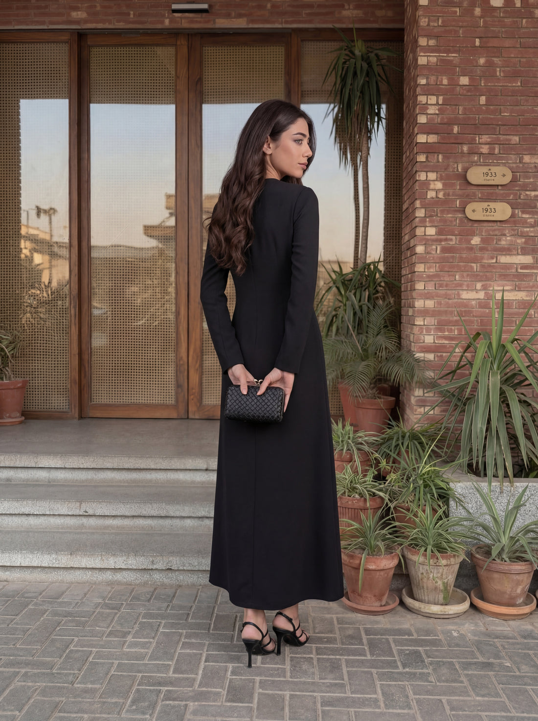 Elegant long dress with a clean, tailored silhouette
