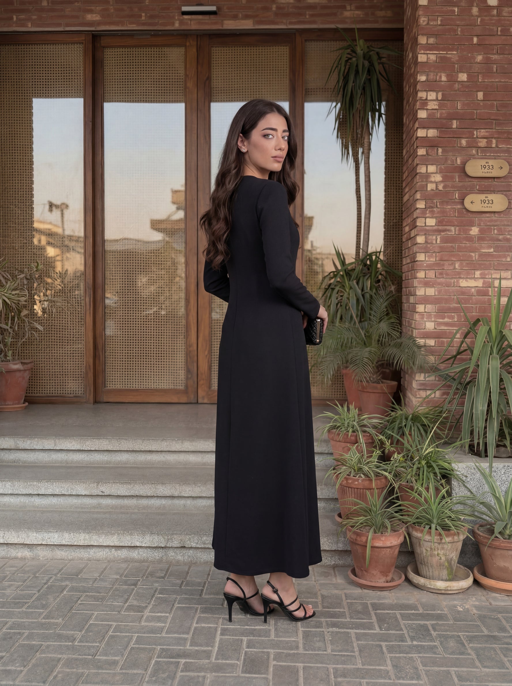 Elegant long dress with a clean, tailored silhouette